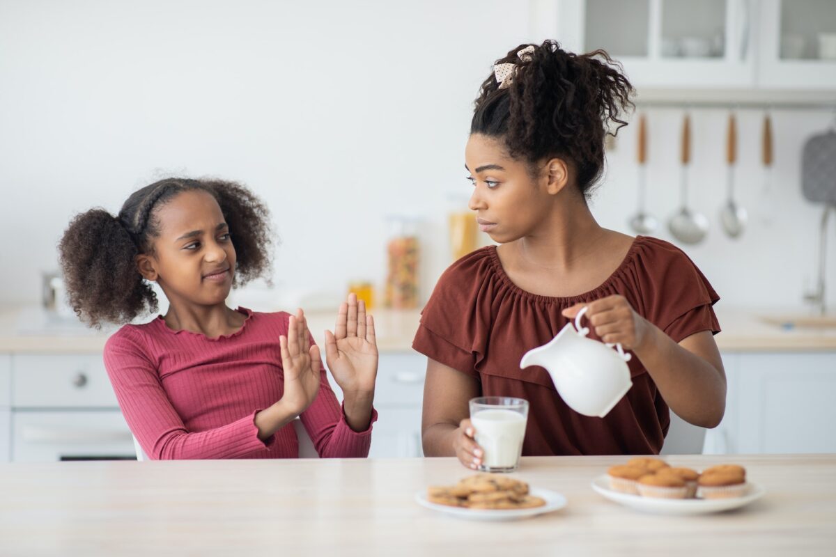 Black teen girl refuse to drink milk