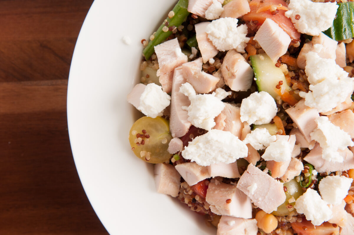 chickpea and quinoa salad with diced chicken and goat cheese