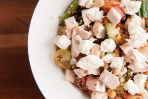 chickpea and quinoa salad with diced chicken and goat cheese