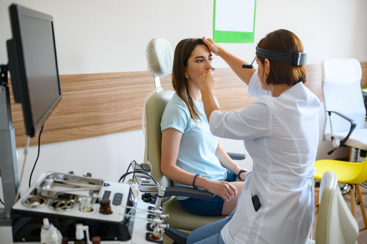 Female ent doctor and patient in office, exam